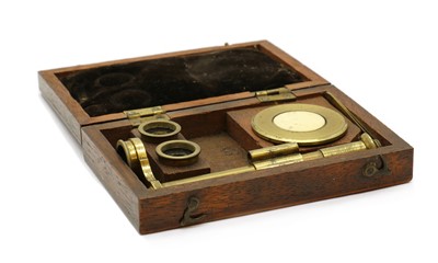 Lot 297 - A cased watchmaker's brass microscope