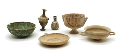 Lot 135 - A collection of Roman pottery, a glass vessel and a bronze? bowl