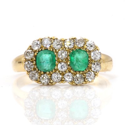 Lot 66 - An Edwardian 18ct gold emerald and diamond double cluster ring