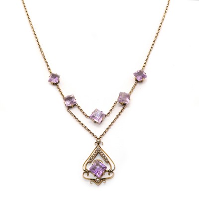 Lot 78 - An Edwardian gold, amethyst and split pearl necklace