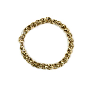 Lot 129 - A 9ct gold curb and roller link bracelet