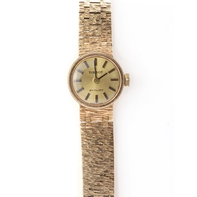 Lot 324 - A ladies' 9ct gold Tissot 'Stylist' mechanical bracelet watch