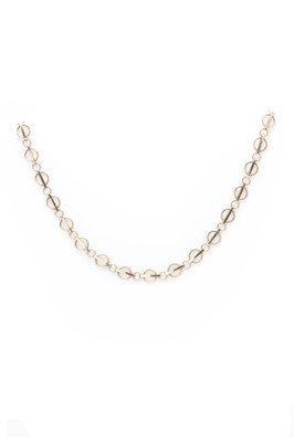 Lot 1080 - A 9ct gold necklace, c.1960