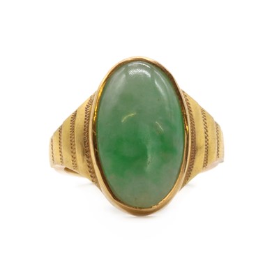 Lot 126 - A gold single stone jade ring