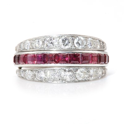 Lot 111 - A ruby, sapphire and diamond swivel guard or flip eternity ring