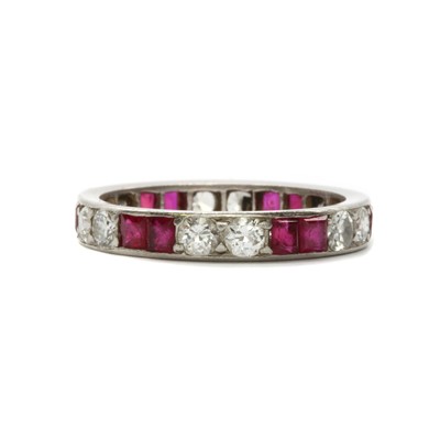 Lot 29 - A synthetic ruby and diamond full eternity ring