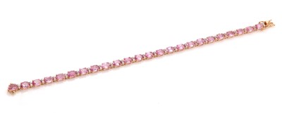 Lot 379 - An 18ct rose gold, pink sapphire and diamond line bracelet