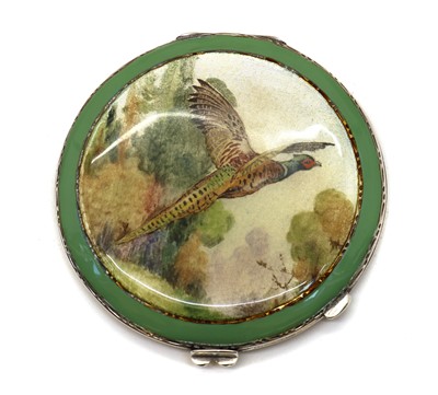Lot 75 - An enamelled silver compact