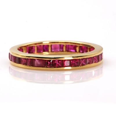 Lot 418 - An 18ct gold ruby full eternity ring