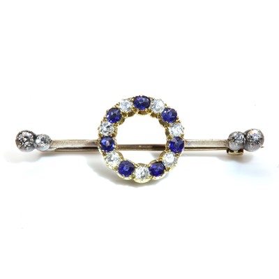 Lot 55 - A late Victorian sapphire and diamond hoop bar brooch