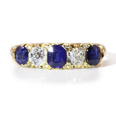 Lot 52 - An 18ct gold late Victorian sapphire and diamond carved head ring