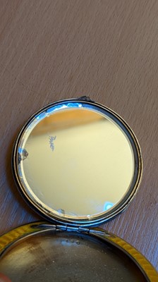 Lot 65 - An enamelled silver compact