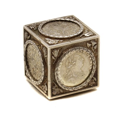 Lot 99 - A silver coin cube