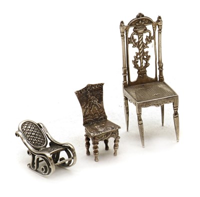 Lot 108 - A group of three novelty silver chairs