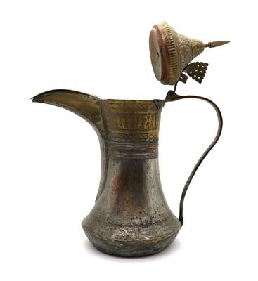 Lot 182 - A large tinned copper and brass dallah coffee pot