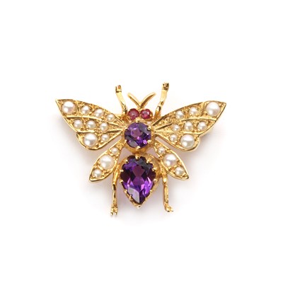 Lot 1200 - A 9ct gold amethyst, ruby and split pearl set bee brooch