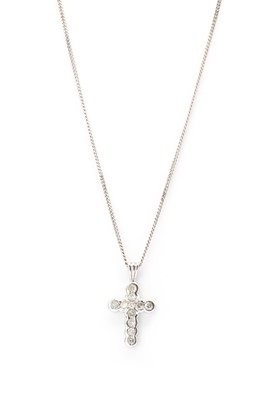 Lot 1176 - An 18ct white gold diamond set cross pendant