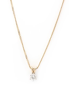 Lot 1121 - A 9ct gold single stone diamond pendant and chain