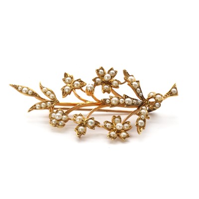 Lot 1029 - An Edwardian gold split pearl spray brooch