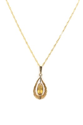 Lot 35 - A 9ct gold single stone citrine pendant, c.1970