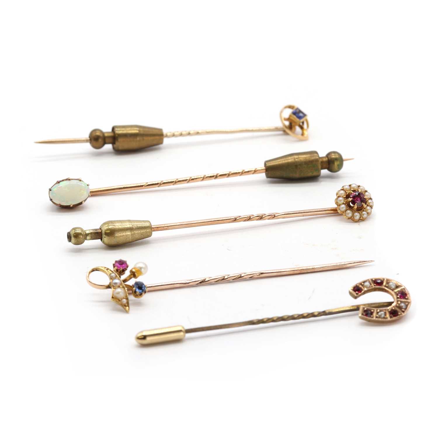Lot 8 - A collection of stick pins,