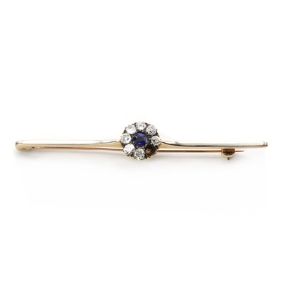 Lot 1040 - An Edwardian gold sapphire and diamond cluster bar brooch