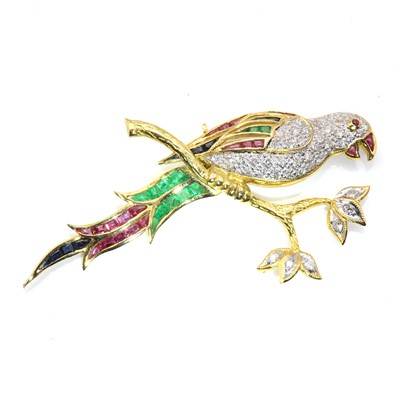 Lot 232 - A gold diamond and gem set bird brooch