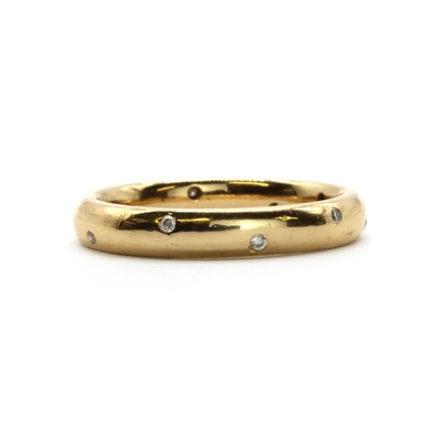 Lot 55 - An 18ct gold diamond set wedding ring