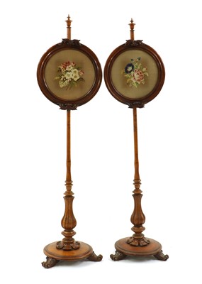 Lot 402 - A pair of Victorian walnut pole screens