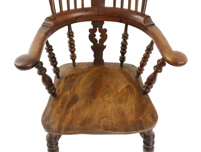 Lot 410 - A elm and beech windsor chair