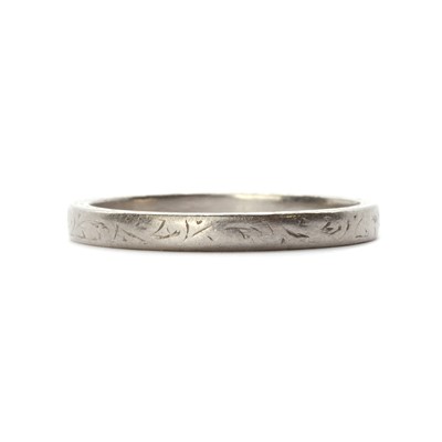 Lot 1160 - A platinum flat section engraved wedding ring