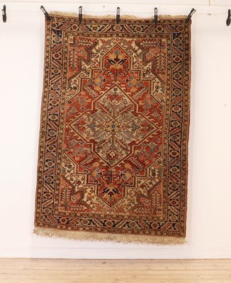 Lot 523 - A hand knotted Heriz rug