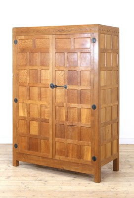 Lot 108 - A Robert 'Mouseman' Thompson panelled oak wardrobe