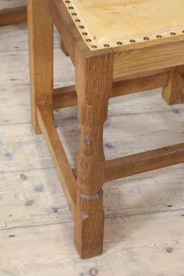 Lot 102 - A set of ten Robert 'Mouseman' Thompson oak dining chairs