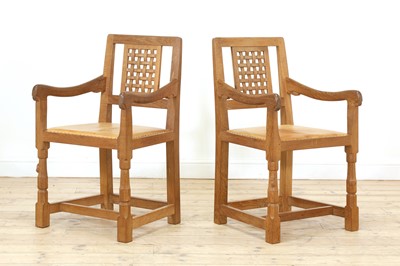 Lot 105 - A pair of Robert 'Mouseman' Thompson oak dining chairs