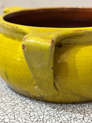 Lot 47 - A rare Liberty & Co. yellow pottery dog bowl