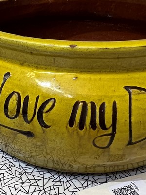 Lot 47 - A rare Liberty & Co. yellow pottery dog bowl