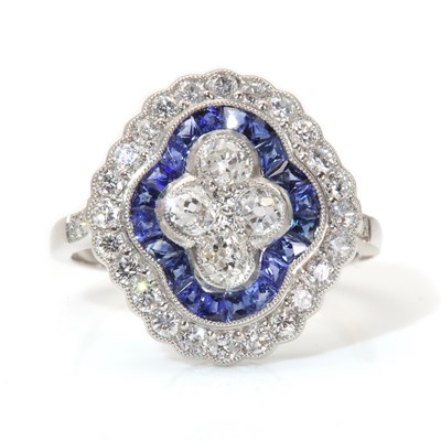 Lot 264 - An Art Deco style diamond and sapphire elongated quatrefoil target style cluster ring