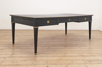 Lot 157 - A Louis XVI-style ebonised oak and brass-mounted bureau plat