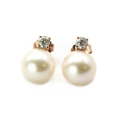 Lot 174 - A pair of rose gold cultured freshwater pearl and diamond stud earrings