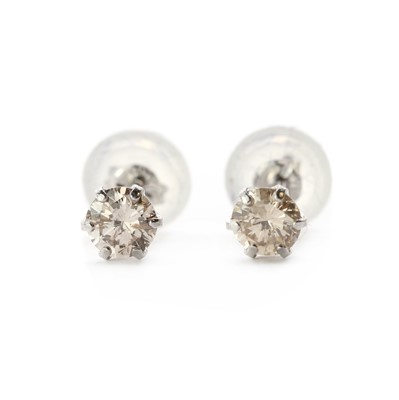 Lot 86 - A pair of single stone diamond stud earrings