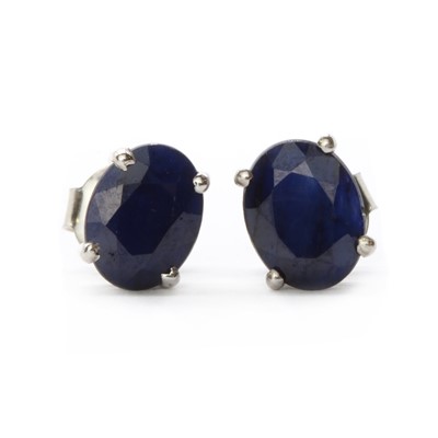 Lot 151 - A pair of silver single stone fracture filled sapphire stud earrings