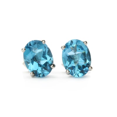 Lot 144 - A pair of silver single stone blue topaz stud earrings