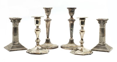 Lot 72 - A pair of Queen Anne style silver candlesticks