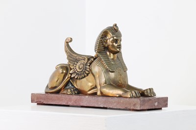 Lot 64 - An Empire-style bronze figure of a sphinx
