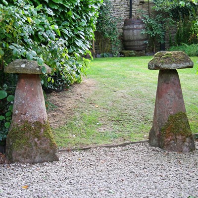 Lot 336 - A pair of tall sandstone staddle stones