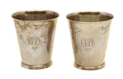 Lot 81 - A pair of silver beakers