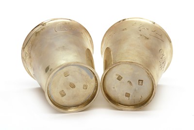 Lot 81 - A pair of silver beakers