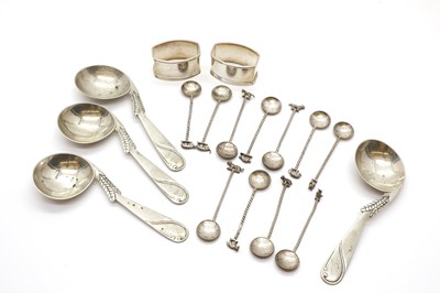 Lot 70 - A set of eleven silver half rupee spoons