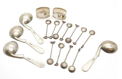 Lot 70 - A set of eleven silver half rupee spoons